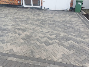 Grey herringbone block paving driveway